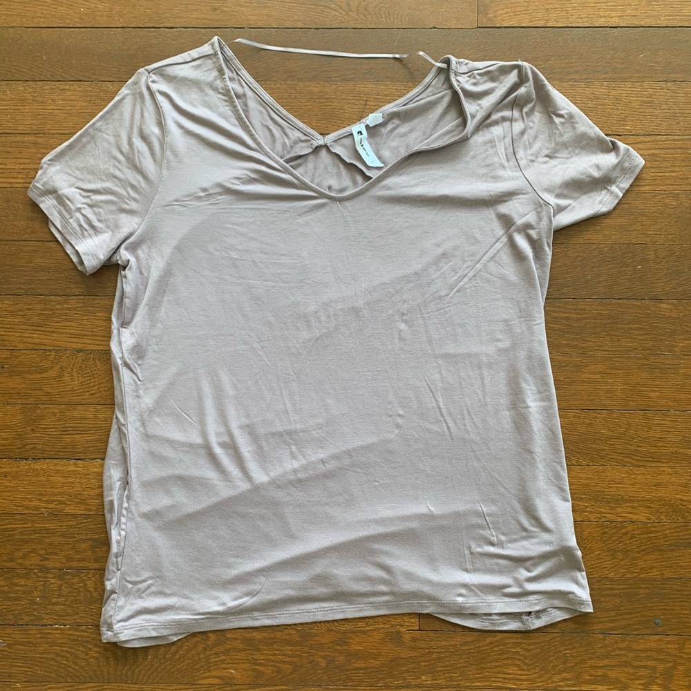 Light purple shirt.